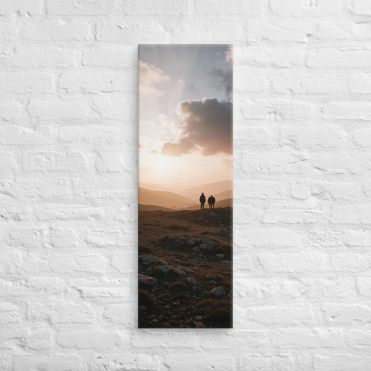 The Last Light Together, tall wrapped canvas print: two figures walking a rocky ridge at sunset, warm golden light over distant mountain peaks.