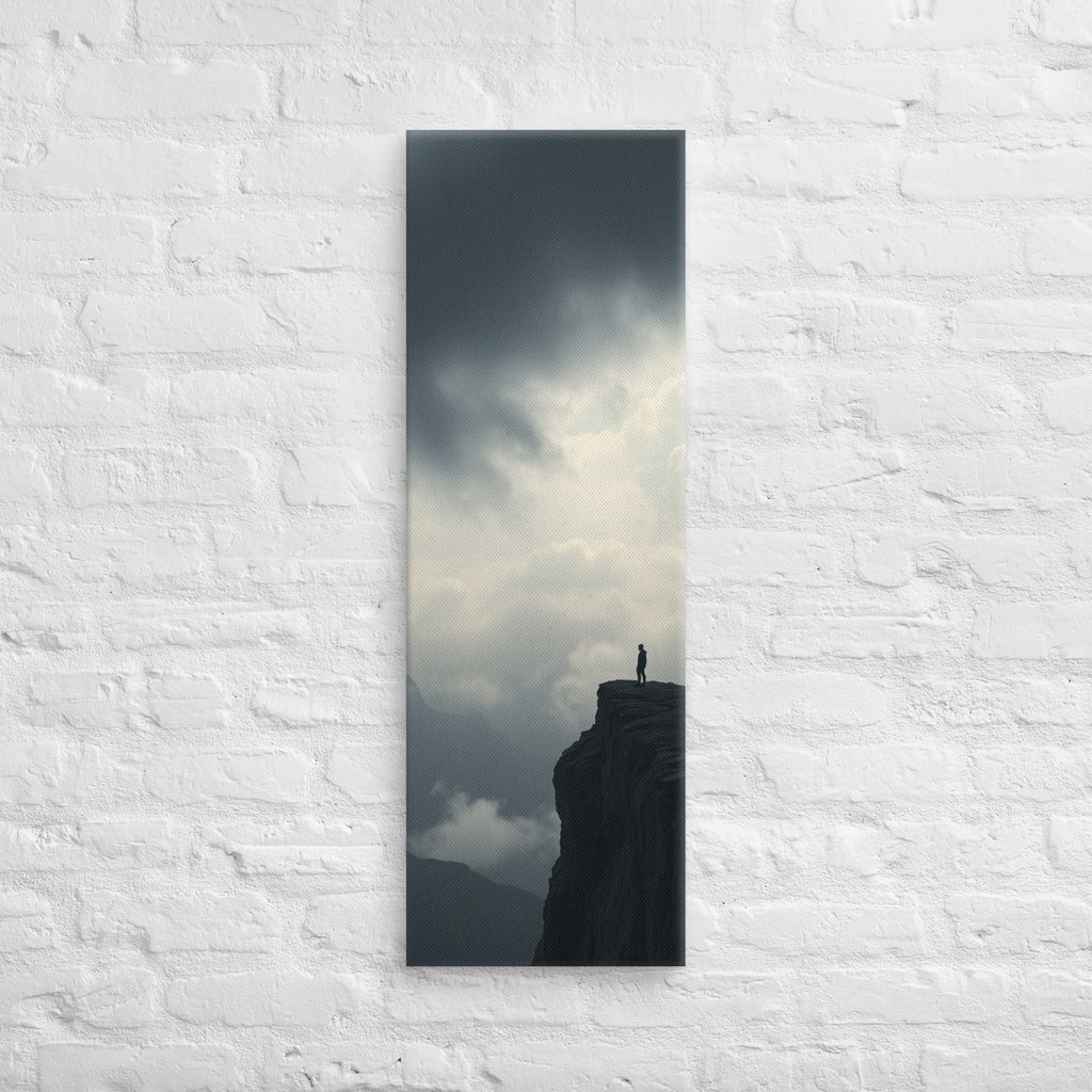 Where the Clouds Break, tall wrapped canvas print: a lone figure on a high cliff as dark clouds split open with light behind.