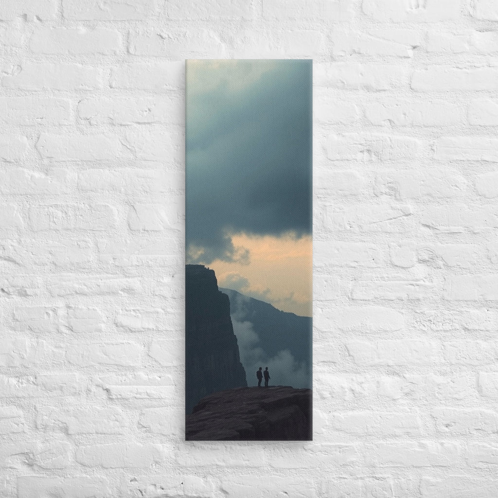 The Evening Overlook, tall wrapped canvas print: two figures on a clifftop at dusk, warm light glowing along the horizon beneath clouds.