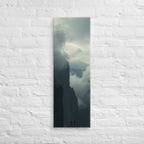 The Clouded Chasm, tall wrapped canvas print: two figures on a dark pinnacle above a chasm of churning cloud between sheer walls.