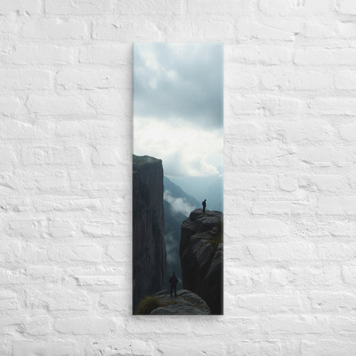 Across the Divide, tall wrapped canvas print: two figures on separate rocky outcrops with a misty mountain divide between them.