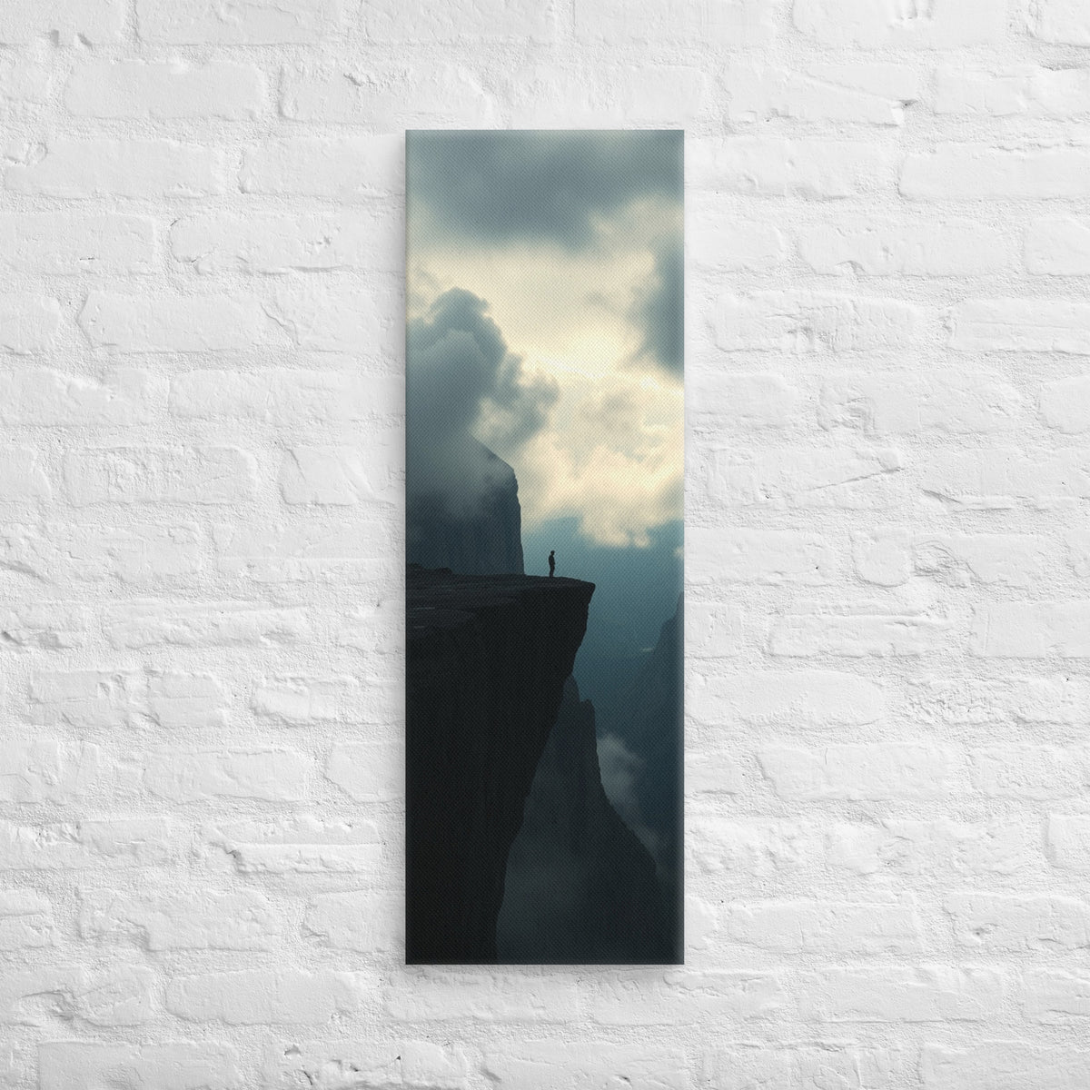 The High Promontory, tall wrapped canvas print: a lone figure at the tip of a dark rocky promontory jutting into clouds.