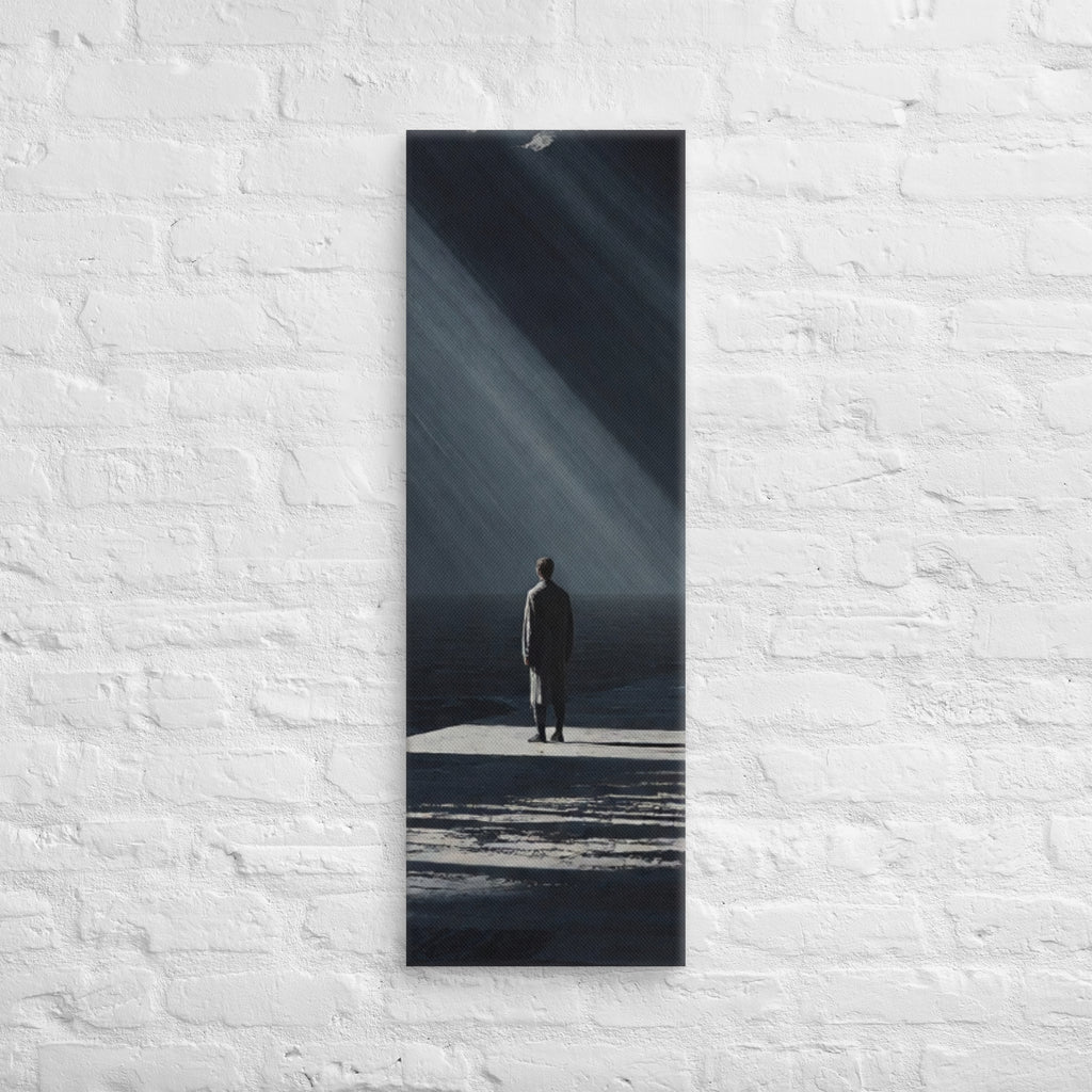 In a Shaft of Light, tall wrapped canvas print: a lone figure at the water's edge beneath dramatic shafts of light breaking through dark clouds.