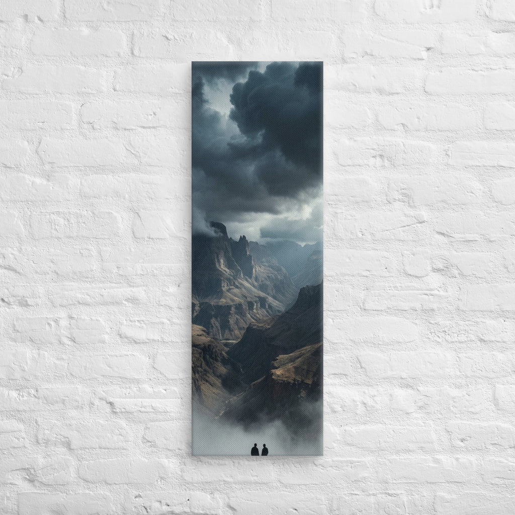 The Valley Below, tall wrapped canvas print: two figures on rocks looking down into a misty valley of dark storm-capped peaks.