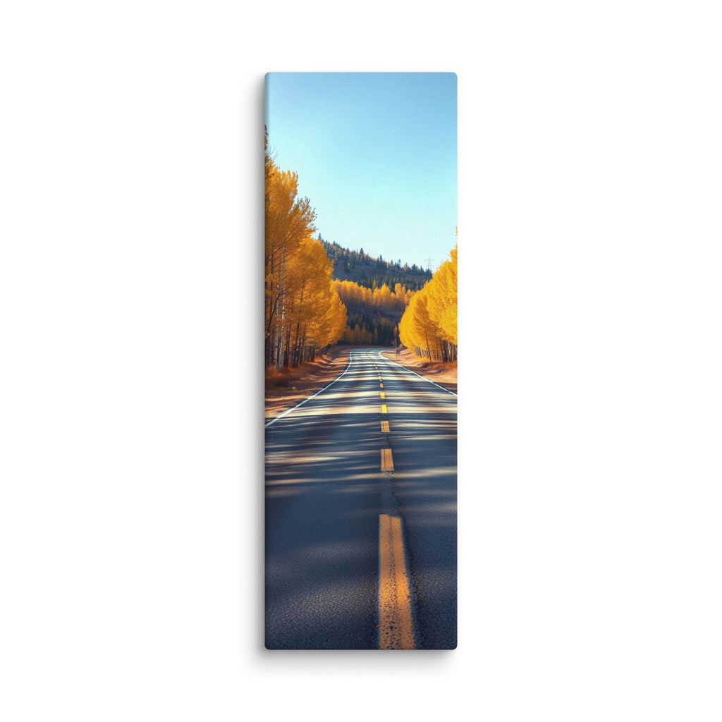 The Amber Turn, tall wrapped canvas print: a straight road through golden aspen trees under a clear blue sky, dappled sunlight on asphalt.
