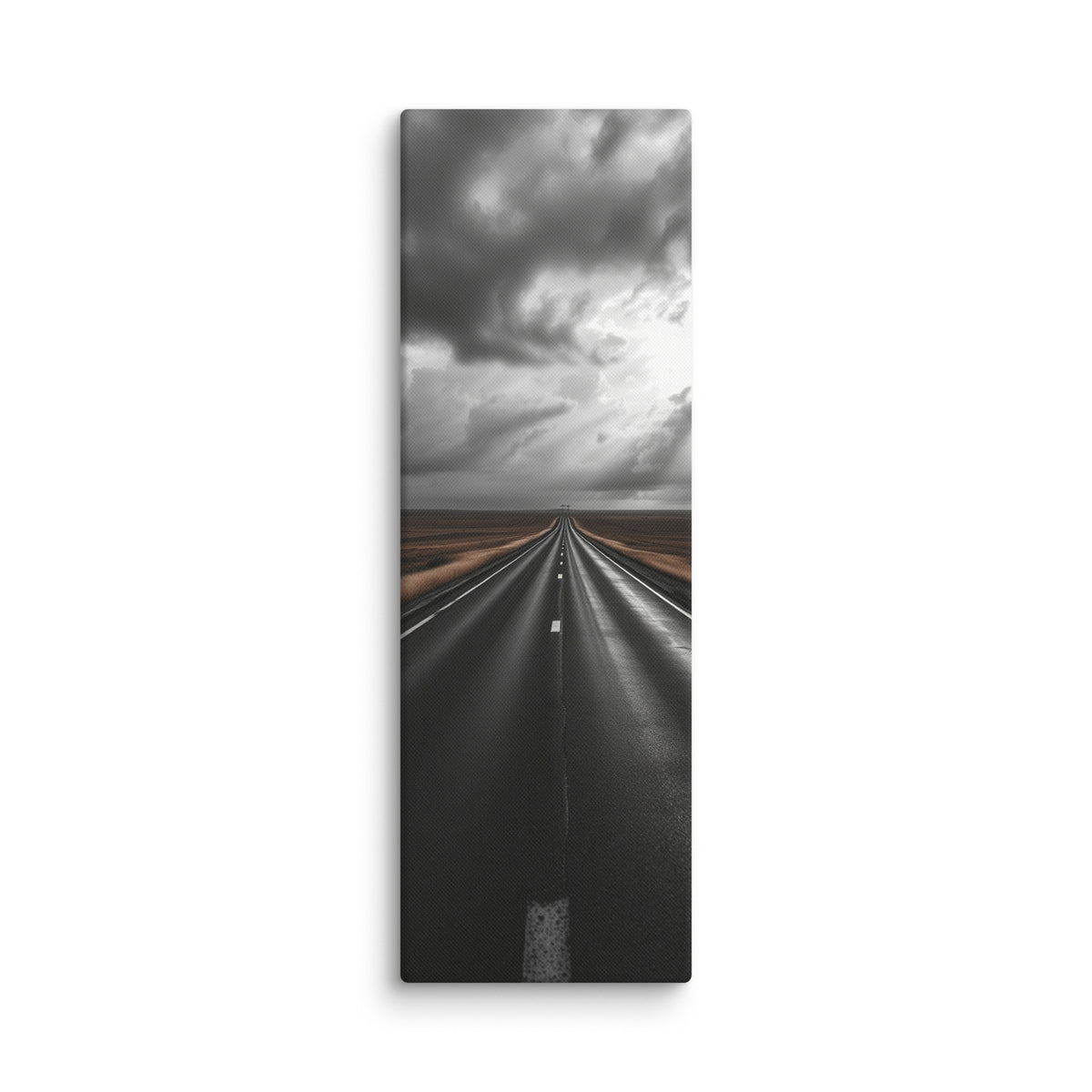 The Weight Of Weather, tall wrapped canvas print: a near-monochrome view of a road beneath an immense wall of dark storm clouds.