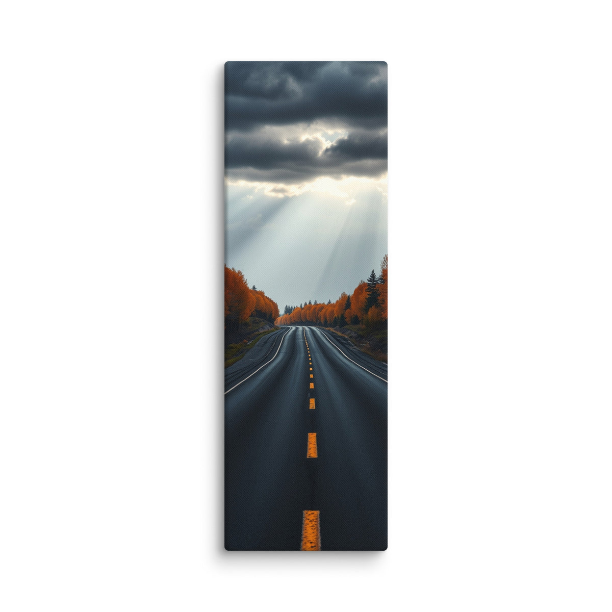 A Break In The Heavens, tall wrapped canvas print: brilliant sunbeams splitting dark storm clouds over a straight road through orange autumn forest.