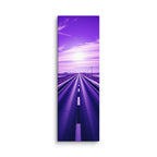 The Violet Hour, tall wrapped canvas print: a road through winter-white plains beneath a vivid violet sky, a bright sun glowing at its center.