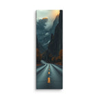 Into The Hidden Pass, tall wrapped canvas print: a road running into a dark gorge between towering cliffs with a sunlit golden peak above the mist.