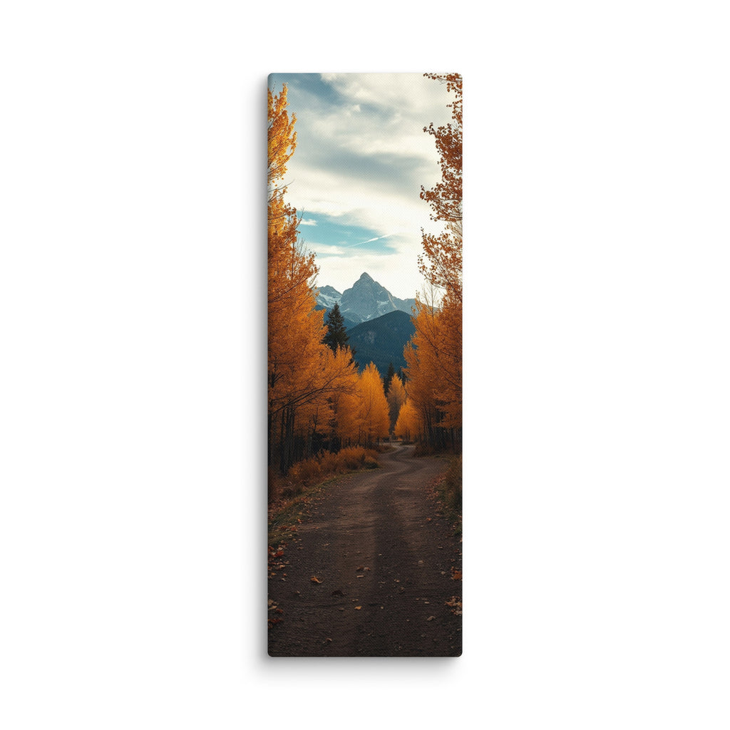 The Peak Beyond The Trees, tall wrapped canvas print: a dirt road through golden autumn trees toward a distant rocky peak.