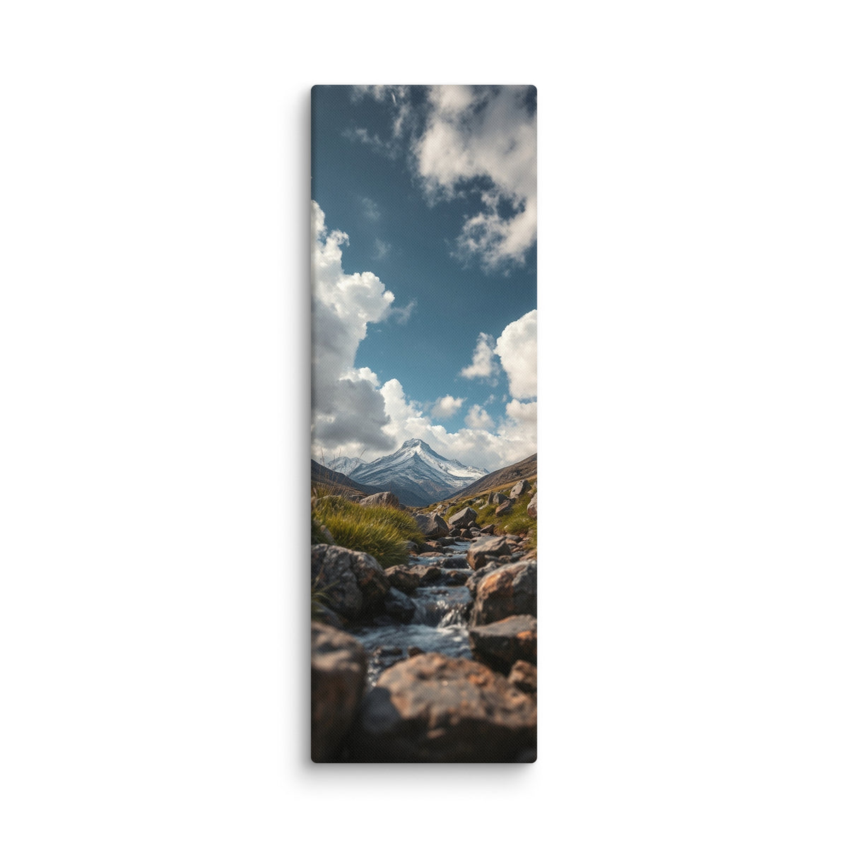 An Answer From The Mountains, tall wrapped canvas print: a rocky stream flowing toward a snow-capped mountain under dramatic clouds.