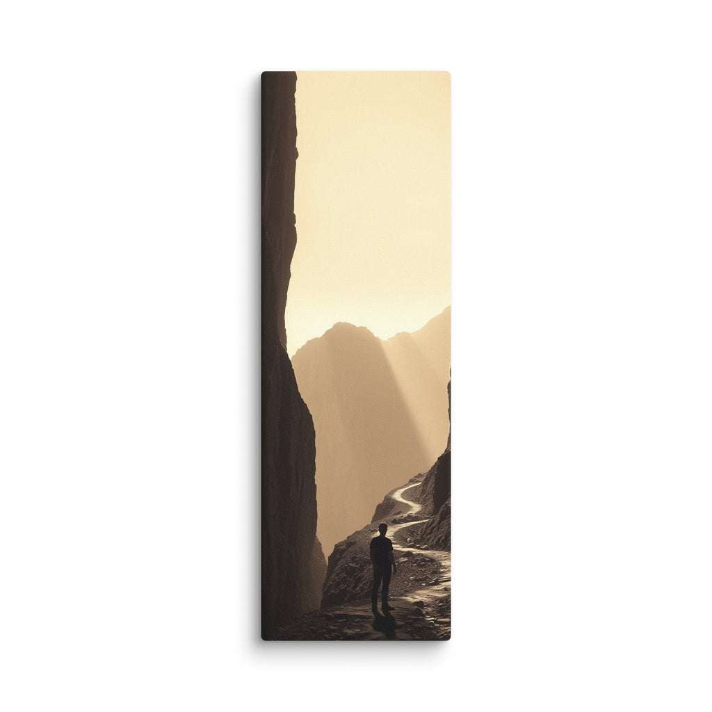 The Golden Defile, tall wrapped canvas print: a lone figure on a ridge path between dark cliffs filled with golden haze and light.