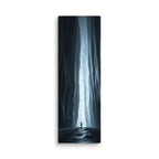 A Blade Of Light, tall wrapped canvas print: a vertical shaft of icy light cutting through a dark slot canyon with a lone figure.