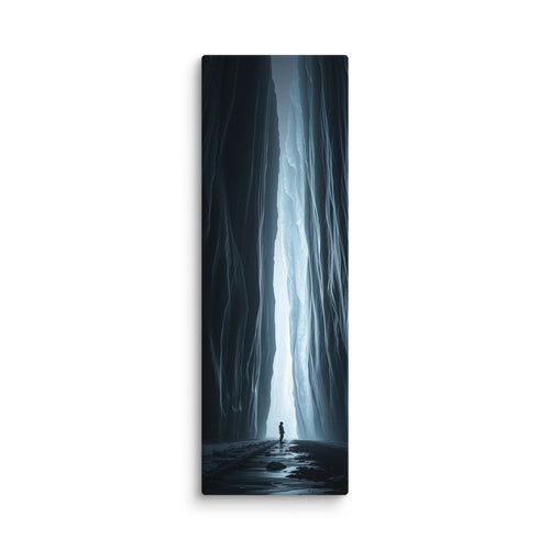 A Blade Of Light, tall wrapped canvas print: a vertical shaft of icy light cutting through a dark slot canyon with a lone figure.