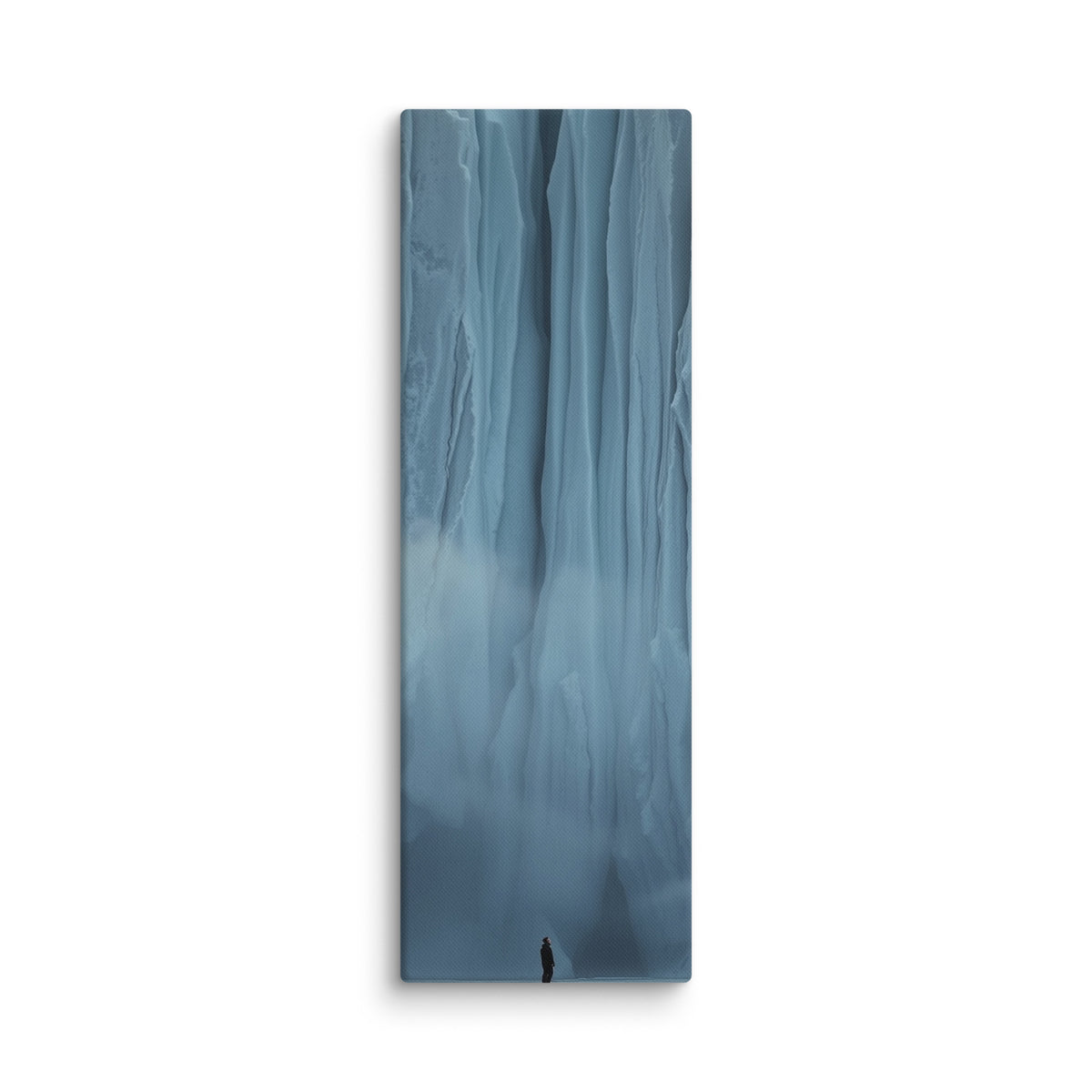 Blue Citadel, tall wrapped canvas print: a lone figure before an immense wall of pale blue ice columns rising into mist.