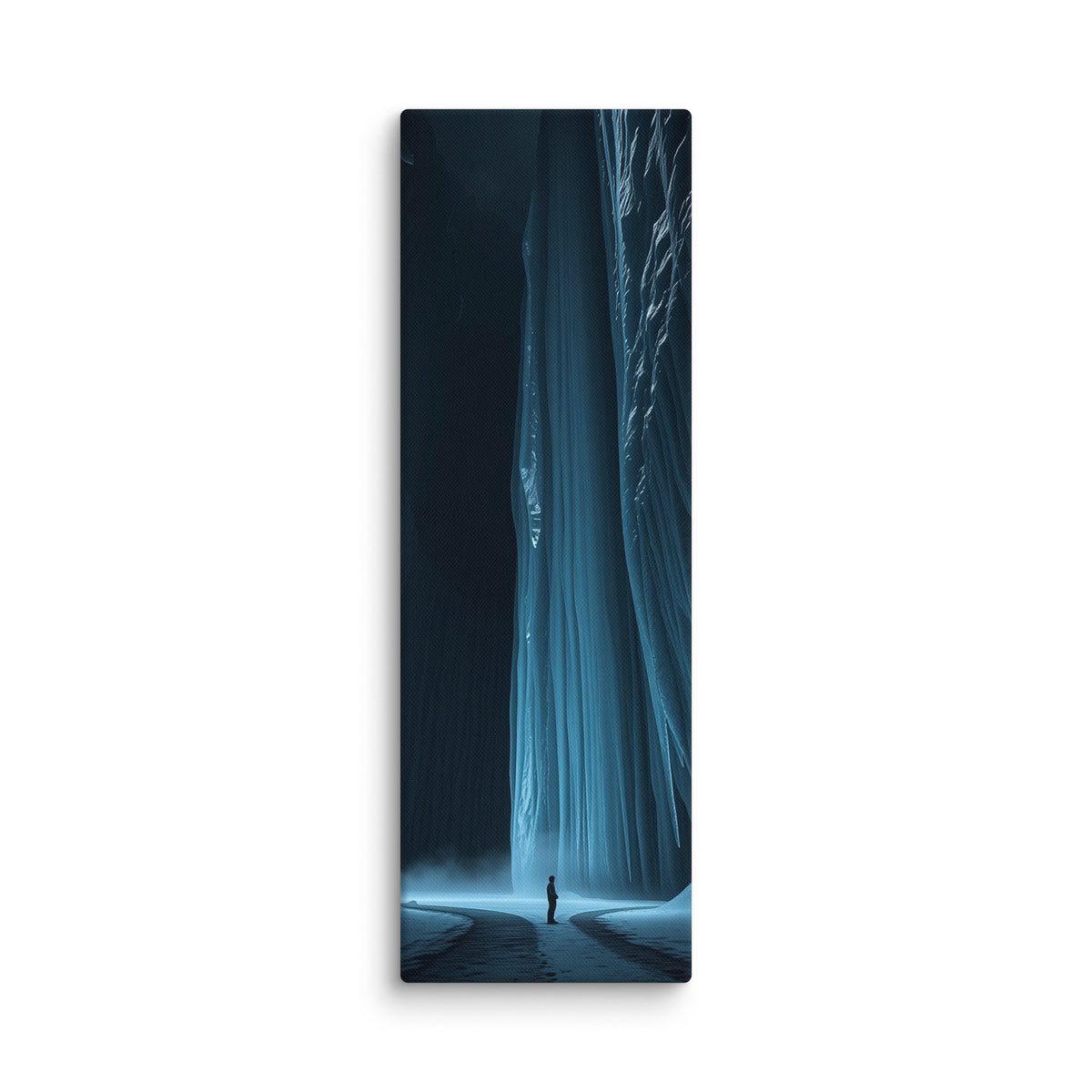 The Blue Divide, tall wrapped canvas print: a lone figure on a snowy path before a colossal glowing blue frozen waterfall between dark ice walls.