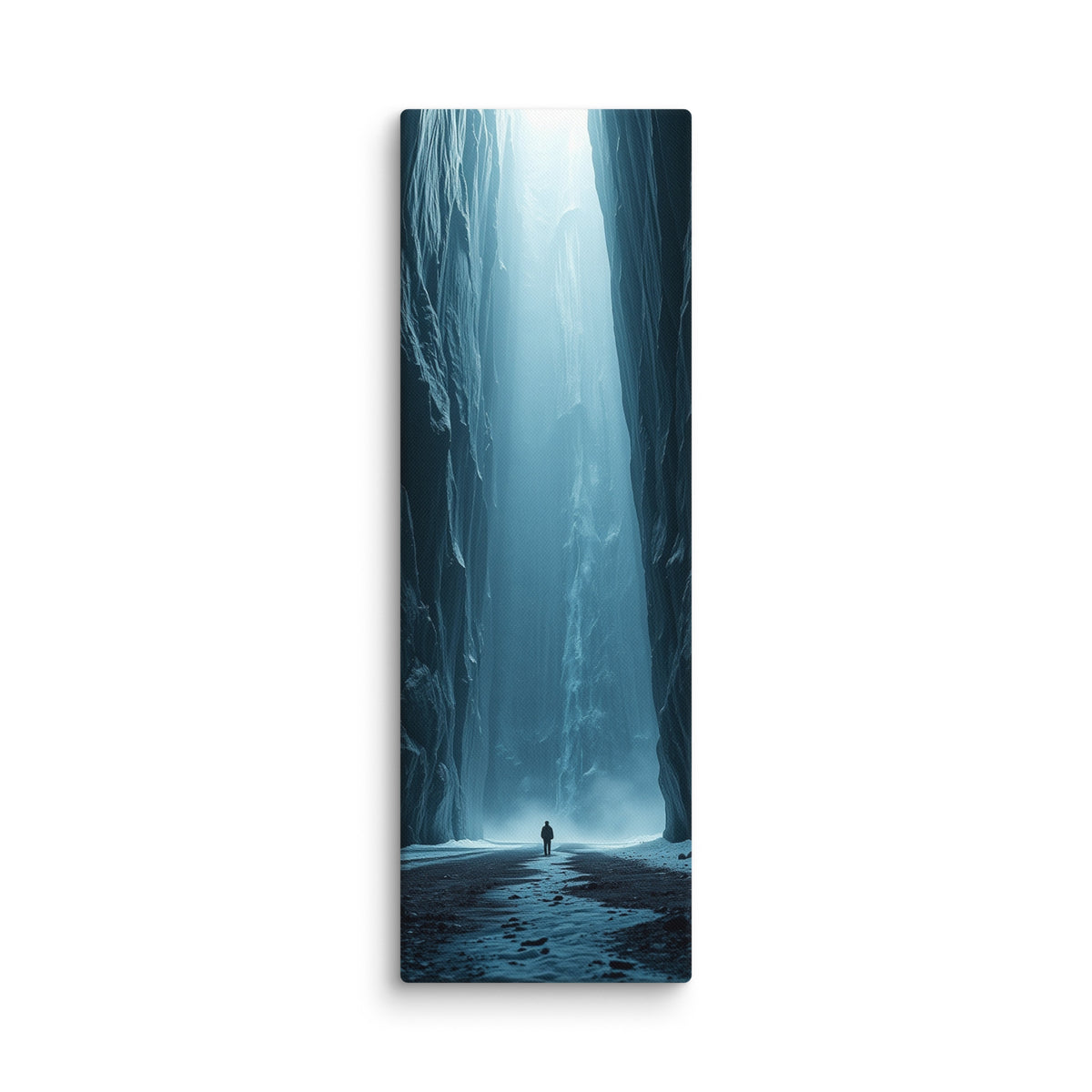The Frozen Nave, tall wrapped canvas print: a lone figure in a blue ice canyon with mist and a shaft of light falling from above.