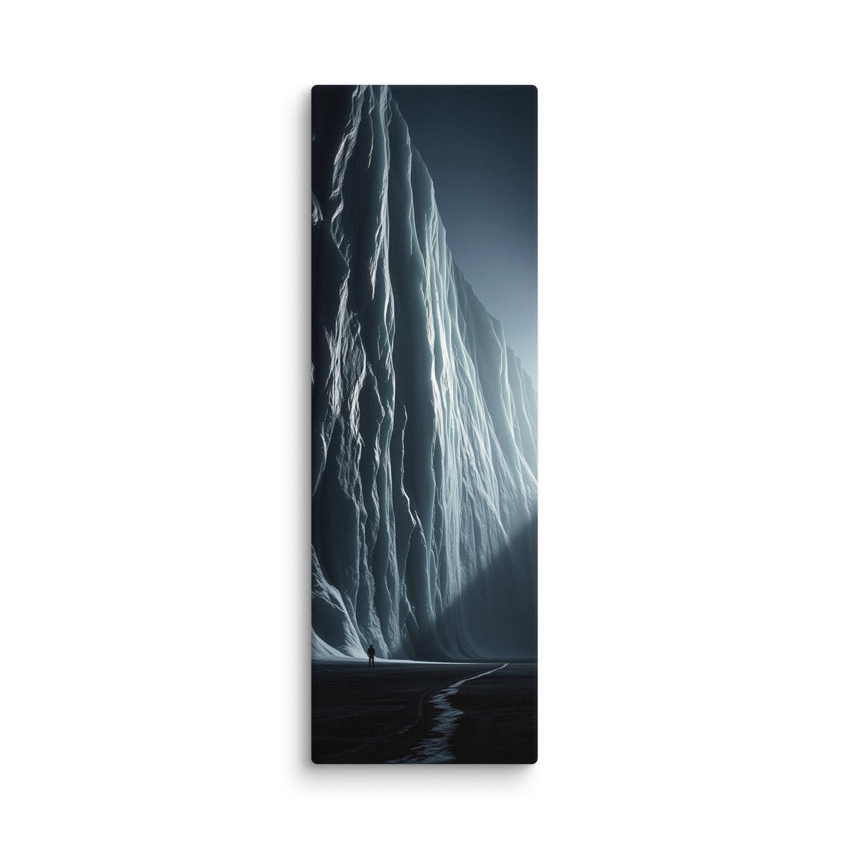 Where Light Breaks, tall wrapped canvas print: a lone figure before a vast ice cliff at night with a shaft of light breaking through on the right.