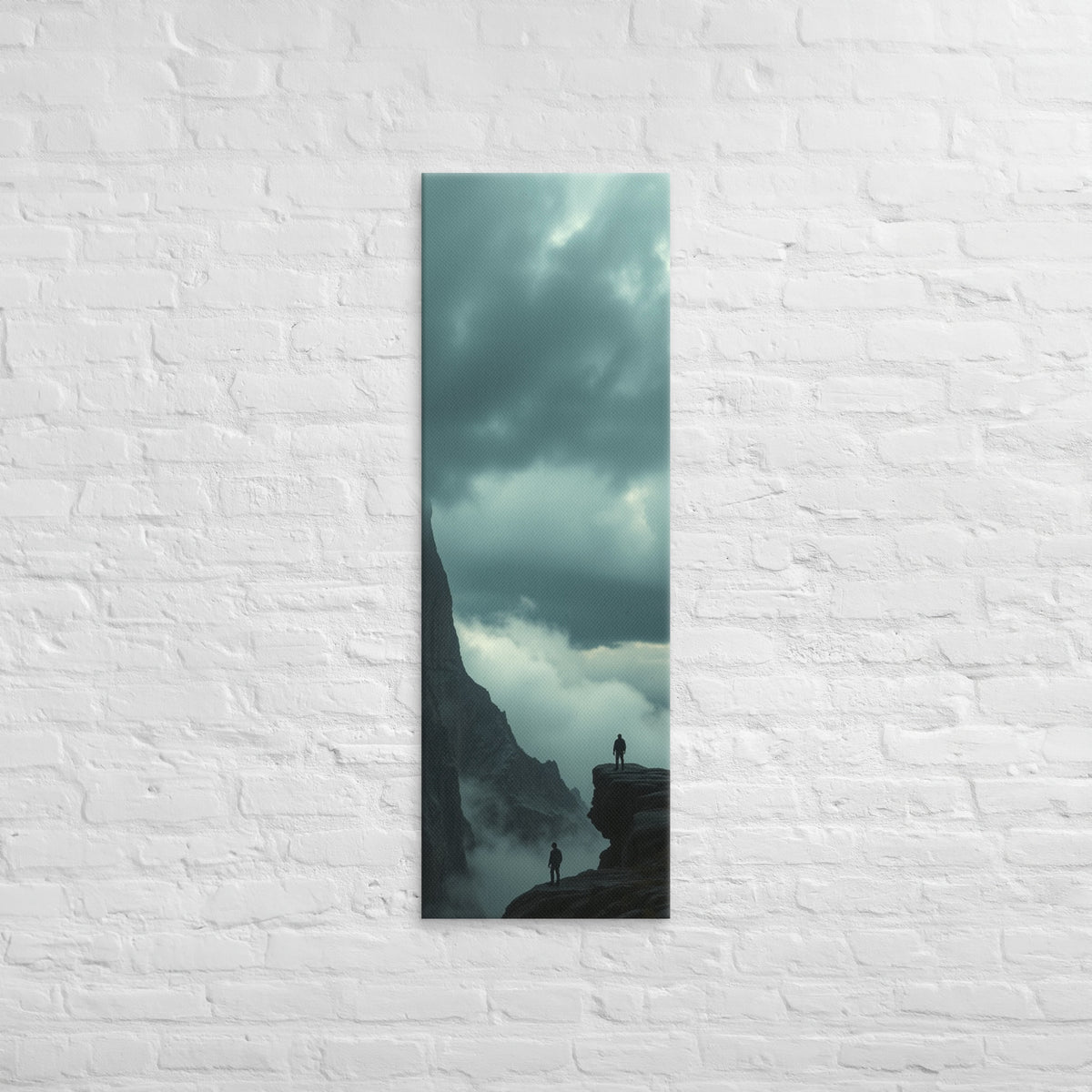 On Separate Ledges, tall wrapped canvas print: two figures standing apart on separate rocky pinnacles amid streaming clouds.