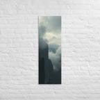 The Clouded Chasm, tall wrapped canvas print: two figures on a dark pinnacle above a chasm of churning cloud between sheer walls.