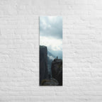 Across the Divide, tall wrapped canvas print: two figures on separate rocky outcrops with a misty mountain divide between them.