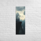 The High Promontory, tall wrapped canvas print: a lone figure at the tip of a dark rocky promontory jutting into clouds.