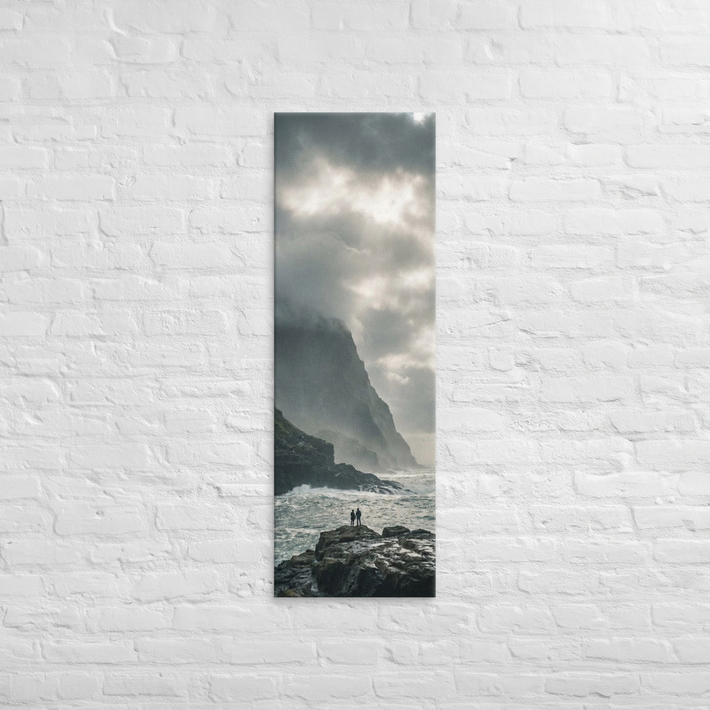 Where the Cliffs Meet the Sea, tall wrapped canvas print: two figures on wave-washed rocks where tall cliffs meet a churning sea.