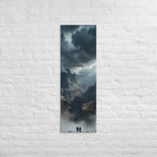 The Valley Below, tall wrapped canvas print: two figures on rocks looking down into a misty valley of dark storm-capped peaks.