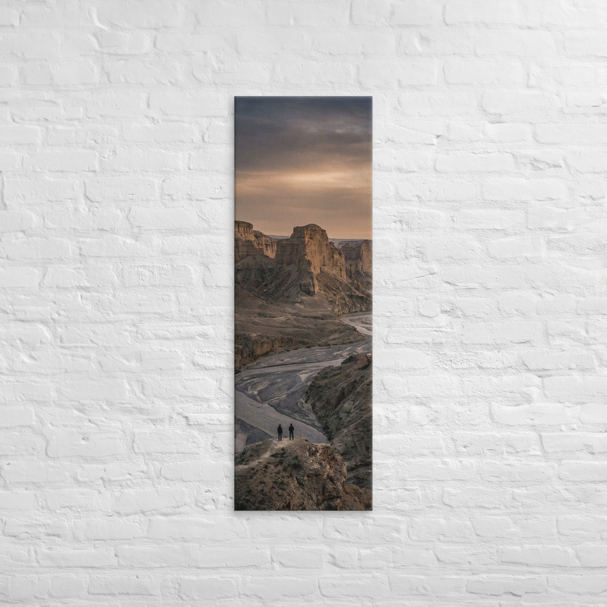 The River Beyond the Ridge, tall wrapped canvas print: three figures on a ridge above a river winding through a dusk-lit canyon.