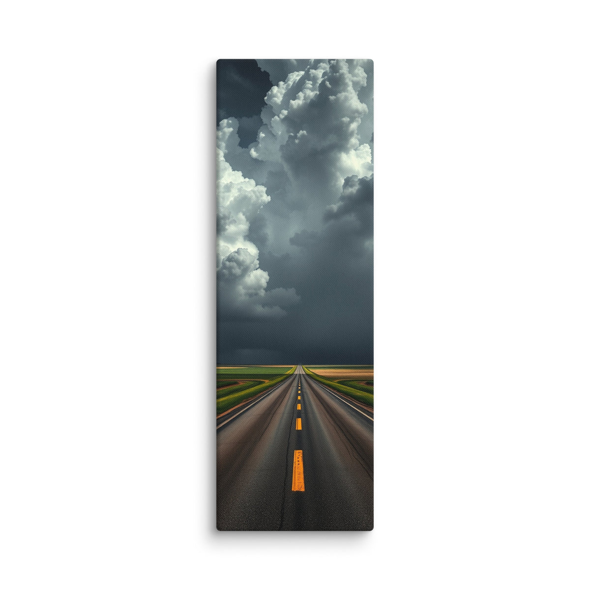 The Gathering Sky, tall wrapped canvas print: an immense white cumulus cloud building over a road through green fields, dark weather behind it.