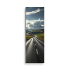 Through The Green Folds, tall wrapped canvas print: a winding road through green rolling hills under towering white cumulus clouds.