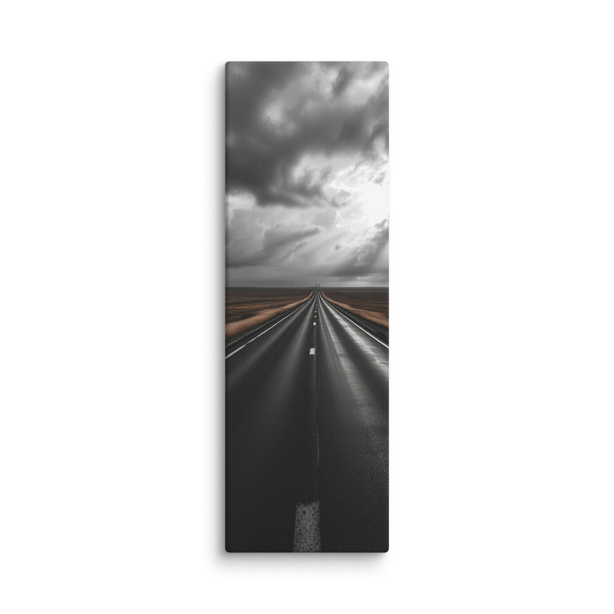 The Weight Of Weather, tall wrapped canvas print: a near-monochrome view of a road beneath an immense wall of dark storm clouds.