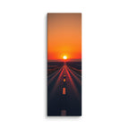 The Horizon Burns, tall wrapped canvas print: a road running straight into a blazing orange-red sunset, red light flooding the asphalt.