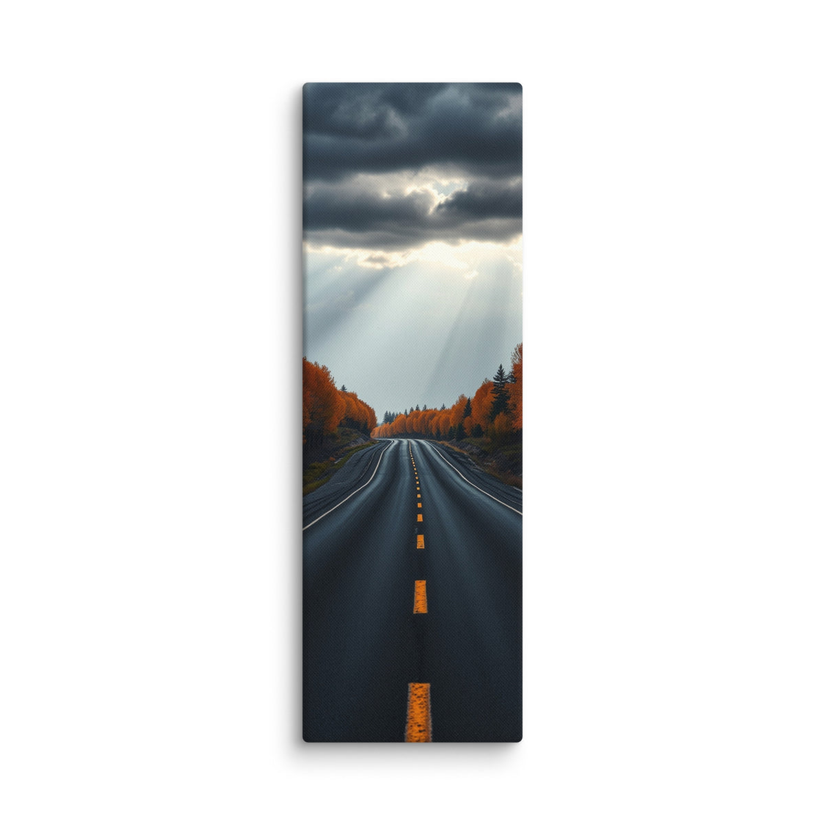 A Break In The Heavens, tall wrapped canvas print: brilliant sunbeams splitting dark storm clouds over a straight road through orange autumn forest.