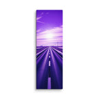 The Violet Hour, tall wrapped canvas print: a road through winter-white plains beneath a vivid violet sky, a bright sun glowing at its center.