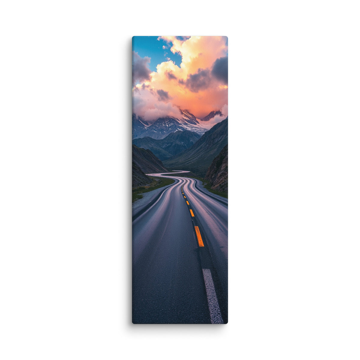 The Rose Lit Summit, tall wrapped canvas print: a serpentine road through a valley toward snow peaks under rose-pink sunset clouds.