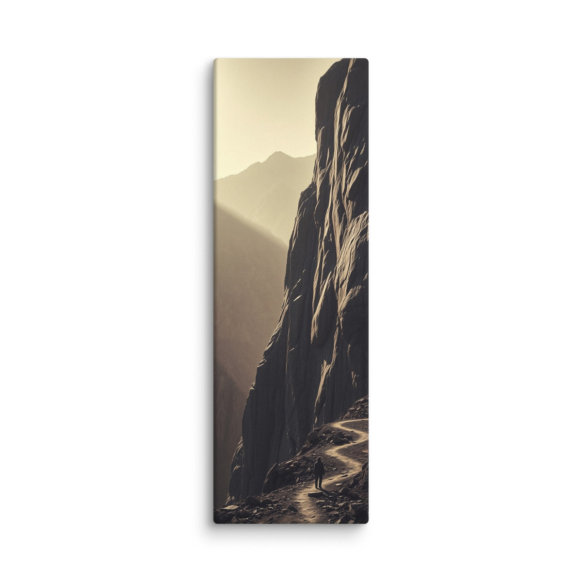 The Ascending Light, tall wrapped canvas print: a lone figure on a winding cliff path as golden light climbs a mountain ridge.
