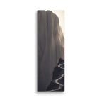 The Narrow Way, tall wrapped canvas print: a tiny figure on a thin dark path winding along a pale misty cliff face.