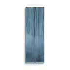 Blue Citadel, tall wrapped canvas print: a lone figure before an immense wall of pale blue ice columns rising into mist.