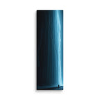 The Blue Vein, tall wrapped canvas print: an electric-blue frozen waterfall glowing in darkness with a lone silhouetted figure.