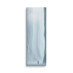 Where Forms Dissolve, tall wrapped canvas print: a lone figure in a bright white ice passage dissolving into light.