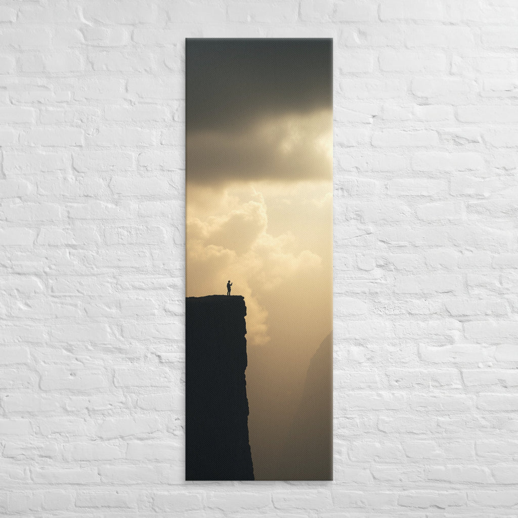 The Edge of Gold, tall wrapped canvas print: a tiny silhouetted figure at the edge of a black cliff against a luminous gold sky.