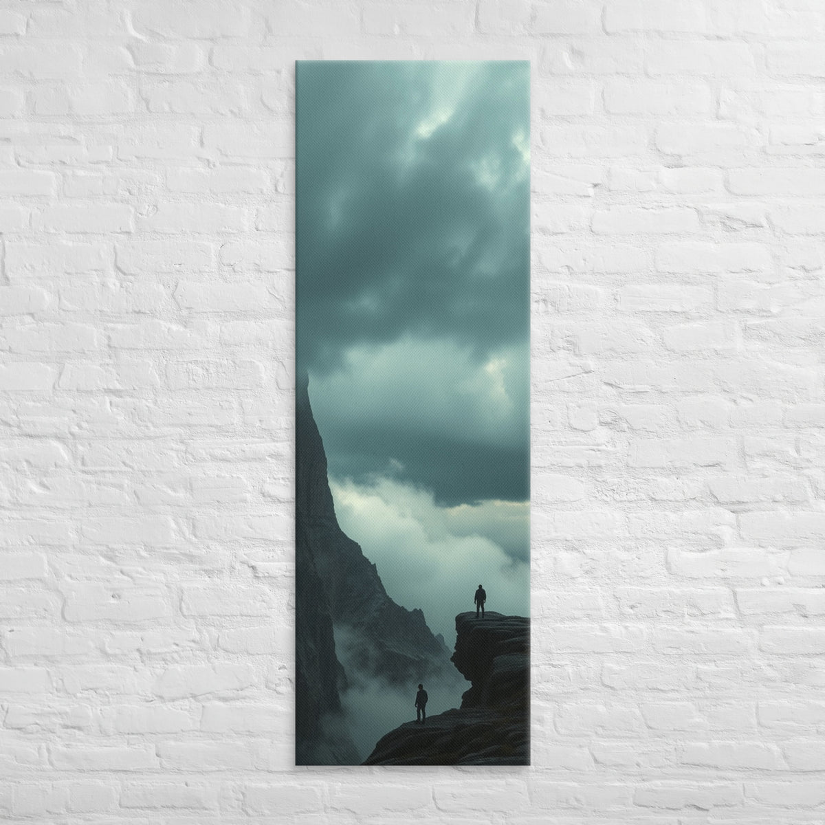 On Separate Ledges, tall wrapped canvas print: two figures standing apart on separate rocky pinnacles amid streaming clouds.
