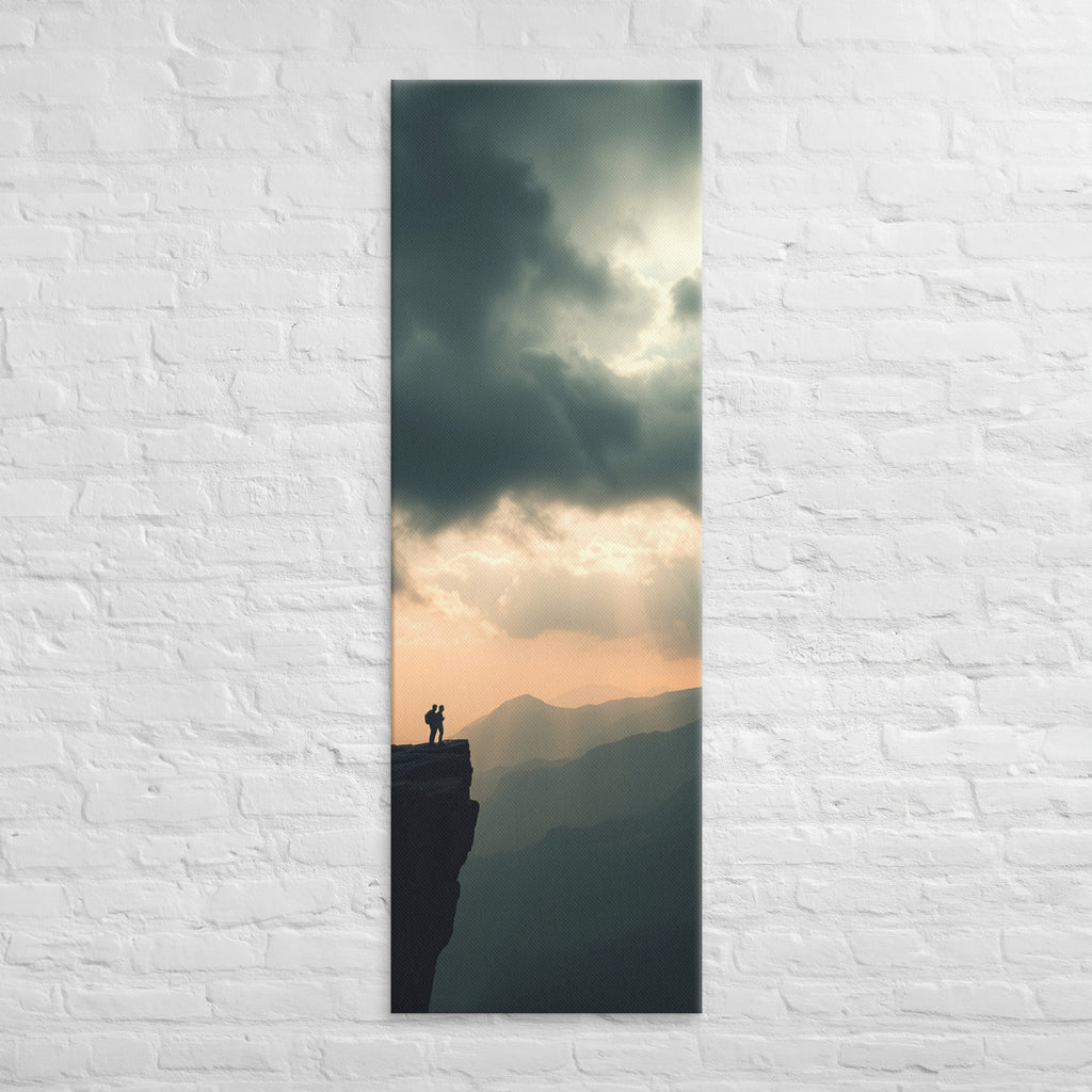The Amber Distance, tall wrapped canvas print: two figures on a cliff edge facing an amber sunset sky with light rays over layered ridges.