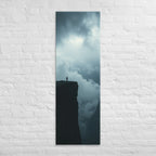 At the Cloudline, tall wrapped canvas print: a lone figure at a cliff edge with storm clouds boiling below and dark sky above.