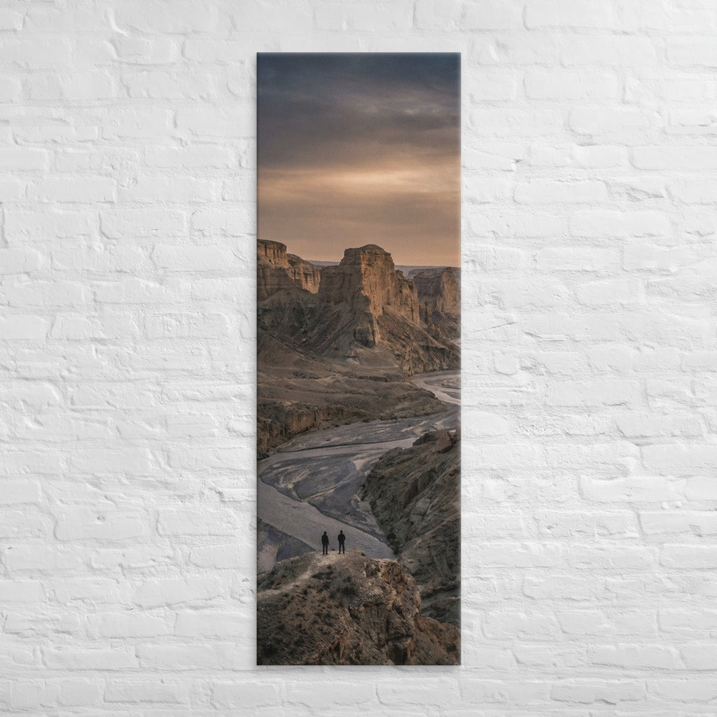 The River Beyond the Ridge, tall wrapped canvas print: three figures on a ridge above a river winding through a dusk-lit canyon.