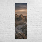 The River Beyond the Ridge, tall wrapped canvas print: three figures on a ridge above a river winding through a dusk-lit canyon.