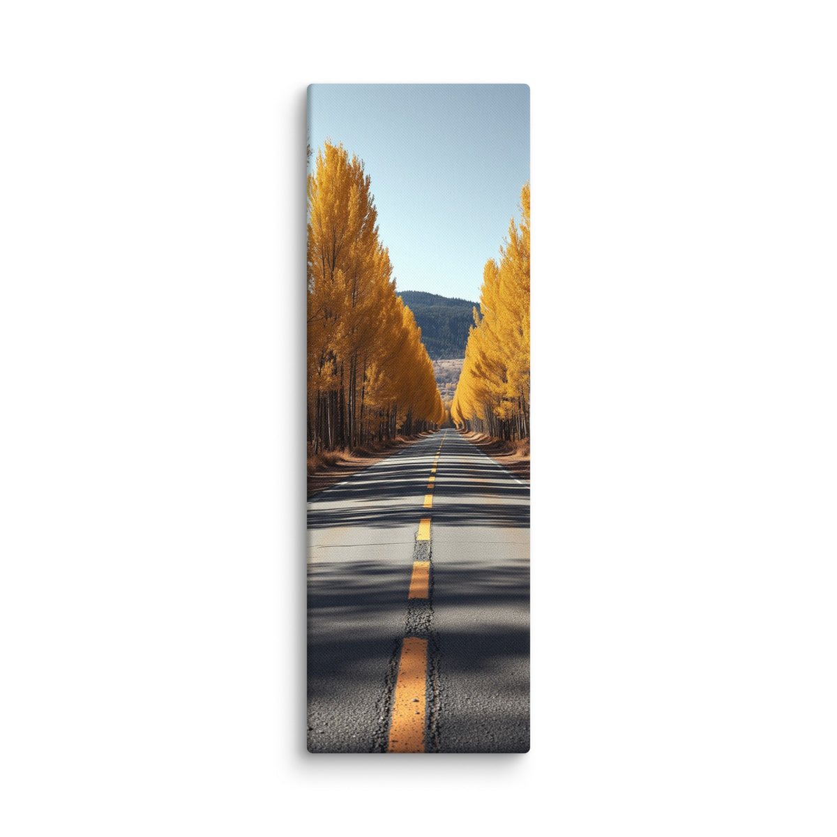 An Avenue Of Gold, tall wrapped canvas print: a straight road flanked by tall golden poplars under a clear blue sky, a forested mountain behind.