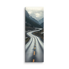 The Silver Approach, tall wrapped canvas print: a serpentine wet road through a silver-grey misty mountain valley.
