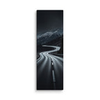 The Night Pass, tall wrapped canvas print: a dark switchback road through snowy mountains at night with distant car headlights.